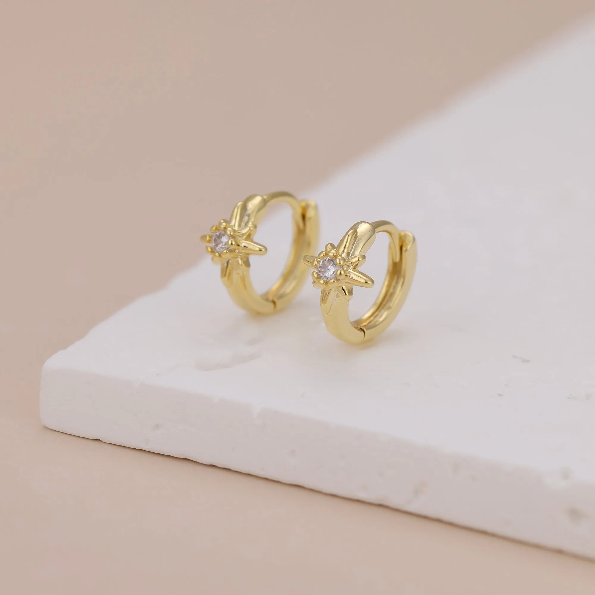 E168 celestial dainty starburst huggie earrings