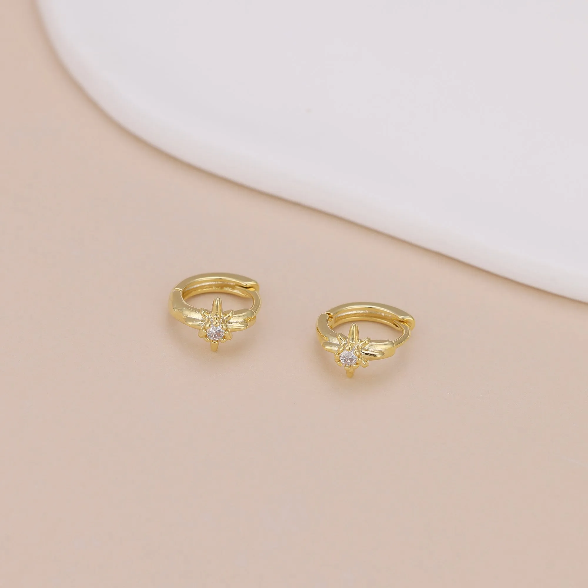 E168 celestial dainty starburst huggie earrings